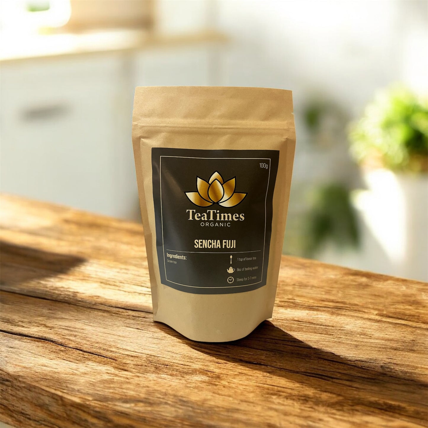 TeaTimes Organic Sencha Fuji tea package on a wooden surface with a blurred background