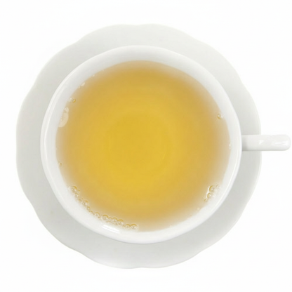 White cup filled with yellow liquid on a white background