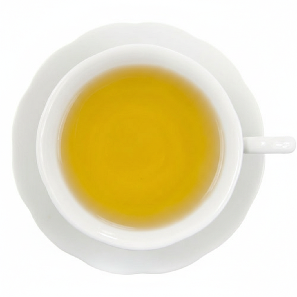 White teacup filled with yellow tea on a white background