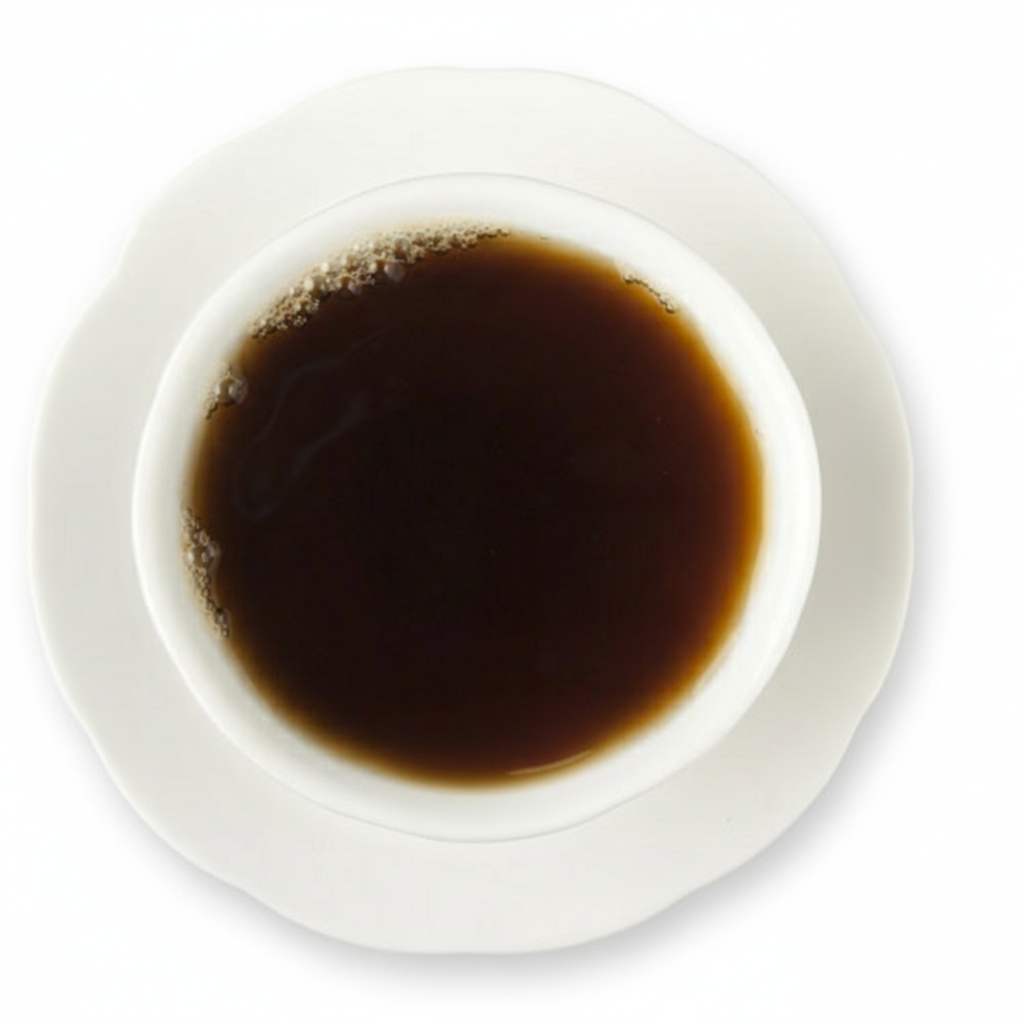 White cup filled with dark liquid on a white background
